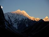 15 Moon and Sunrise On Pemthang Karpo Ri and Triangle From Drakpochen Before the moon can set, the first rays of the sunrise glow on Pemthang Karpo Ri and Triangle from Drakpochen.